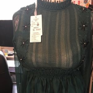 Hunter green long sleeve blouse.